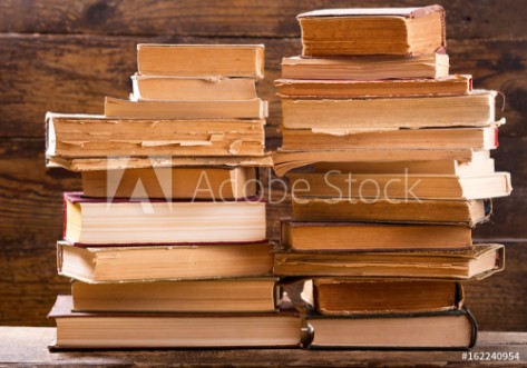 Picture of Old books on a wooden shelf
